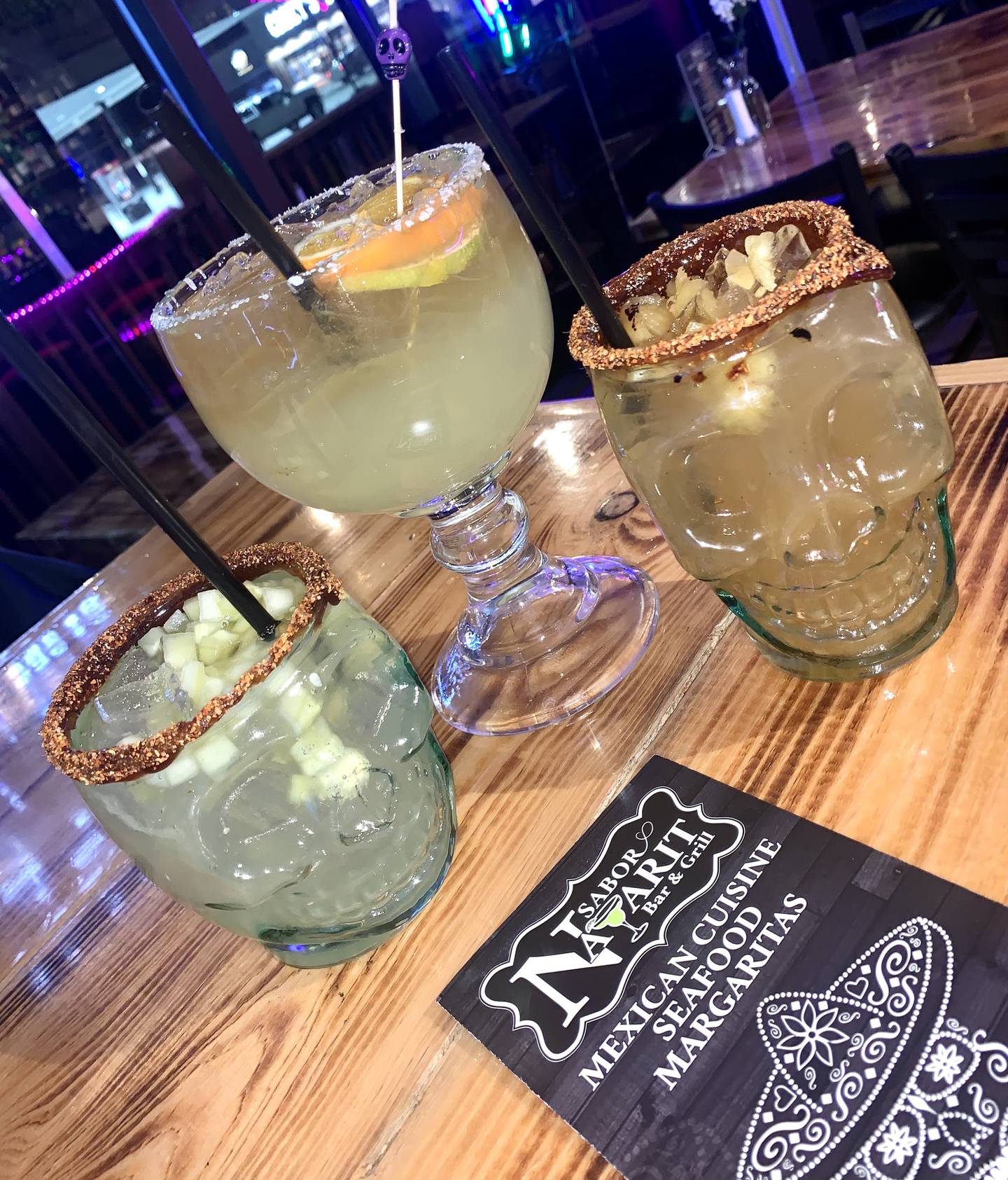 (left to right) Cucumber margarita, nayarit-rita and pineapple smoked margarita