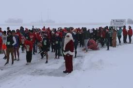 Photos: Santa spirit takes over Spring Valley for annual 5K race