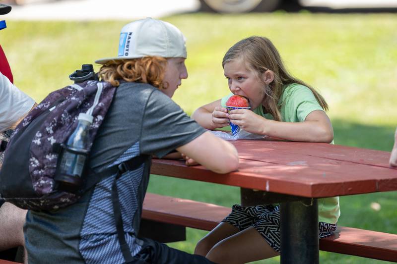 Salem Showen eats snow cone at the Touch a Truck event on Saturday, June 28, 2025 at Centennial Park in Peru.