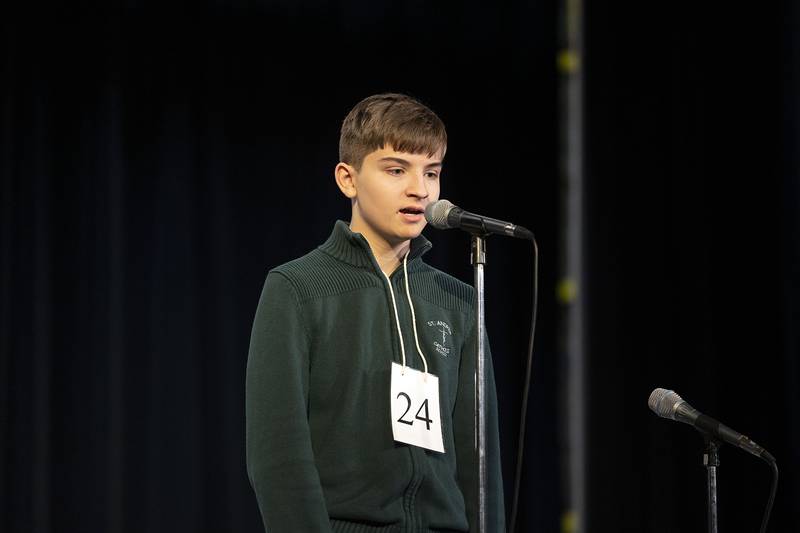 St. Andrew eighth grader Benjamin Spangler appears on stage Thursday, March 9, 2023 during the Lee-Ogle-Whiteside Regional Spelling Bee.
