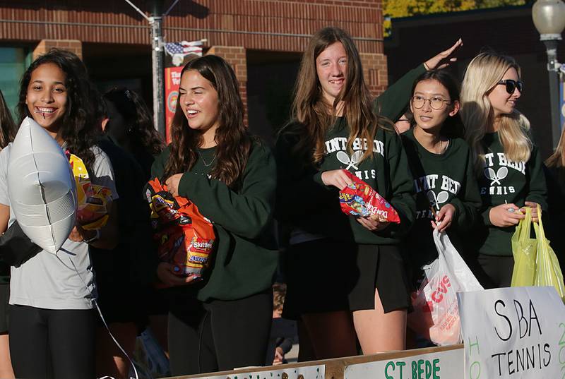 St. Bede tennis players ride in the Homecoming parade on Friday, Sept. 30, 2022 downtown Peru.