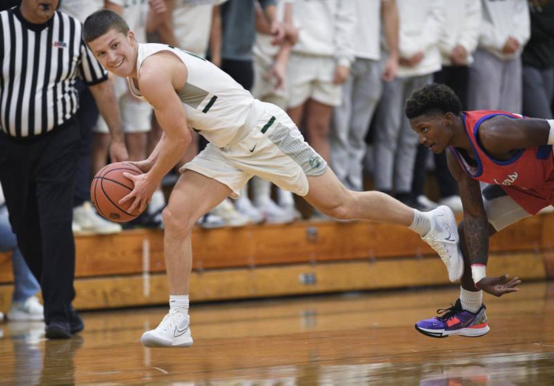 John Starks/jstarks@dailyherald.com
Glenbard West’s Luuk Dusek looks for a teammate as he is chased by Glenbard South’s D'Manuel Payton in a boys basketball game in Glen Ellyn on Monday, November 21, 2022.