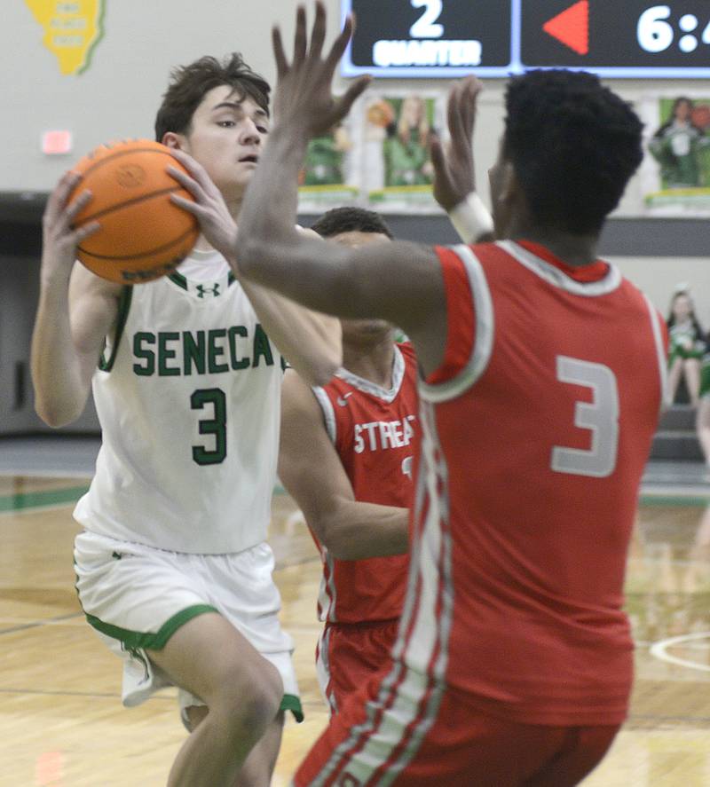 Seneca’s James Zydron drives to the basket as Streator’s Sharon Morton attempts to stop his path in the 2nd period Tuesday at Seneca.