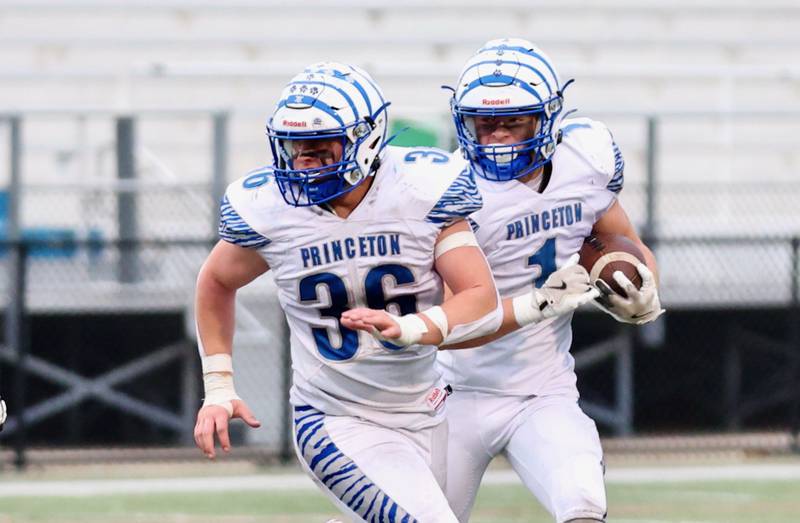 Princeton's Casey Etheridge runs behind a lead block from teammate Common Green in Saturday's game in Chicago. The Tigers won 34-16.