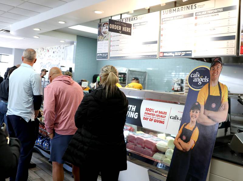 A line forms at Jersey Mike’s Subs in Geneva on Wednesday, March 26, 2025 for the Day of Giving. Jersey Mike’s owners and operators throughout Illinois donated every single dollar that came in that day to Cal’s Angels Pediatric Cancer Foundation, which is based in St. Charles.