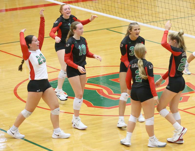 Members of the L-P volleyball team react after defeating Princeton in two sets on Tuesday, Aug. 22, 2023 in Sellett Gymnasium.