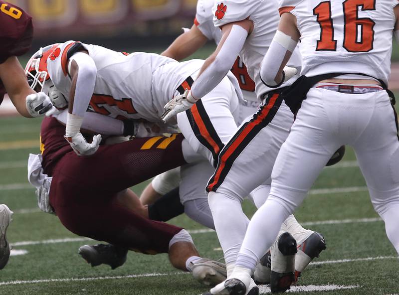Richmond-Burton's Luke Johnson fumbles the football as he is hit by Byron’s Jj Edmonson closes in during an IHSA Class 3A semifinal playoff football game on Saturday, November 22, 2025, at Richmond-Burton High School, in Richmond.