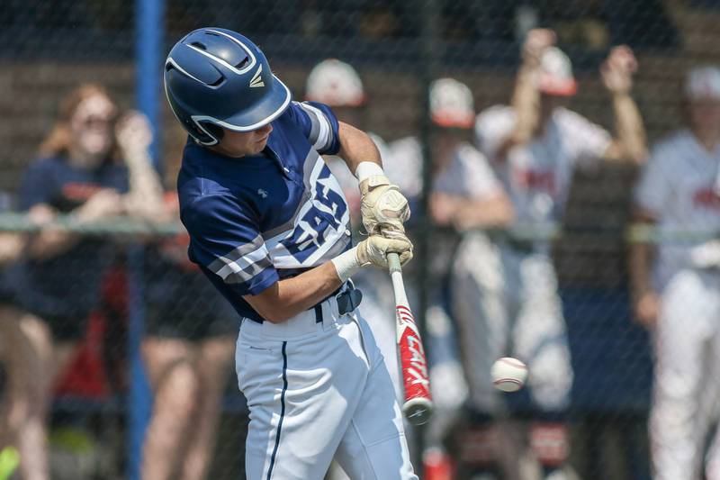 Oswego East's Mike Polubinski (1) swings at a pitch during Class 4A Romeoville Sectional final game between Oswego East at Oswego.  June 3, 2023.