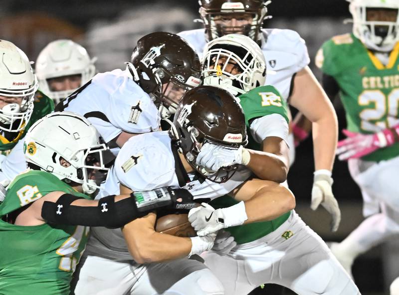 Joliet Catholic's running back Larry Stringham runs the ball during a conference game against Providence Catholic on Friday, Oct 25, 2024 at New Lenox. (Dean Reid for Shaw Local News)