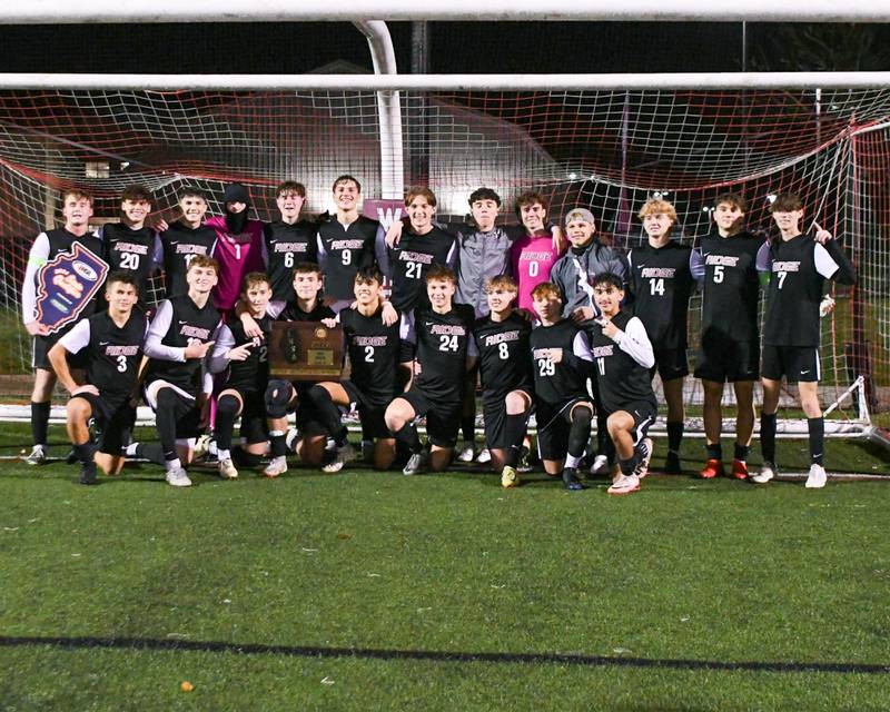 Prairie Ridge’s soccer team poses for a photo after defeating Benet Academy 4-1 during the class 2A super sectional soccer match on Tuesday Nov. 5, 2024, held at Wheaton Academy in West Chicago.