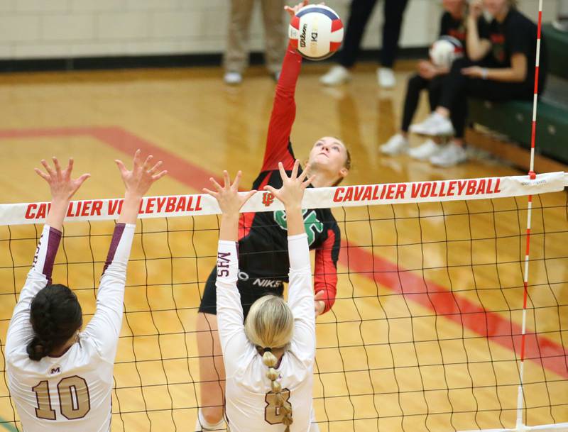 L-P's Aubrey Duttlinger sends a spike past Morris's Aubrey Phillips and Ayla Phillips in the Class 3A Regional game on Thursday, Oct. 26, 2023 at Sellett Gymnasium.