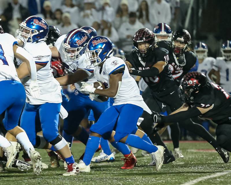 Glenbard South's Carter London (6) runs up the middle during football game between Glenbard South at Glenbard East.   Oct 13, 2023.