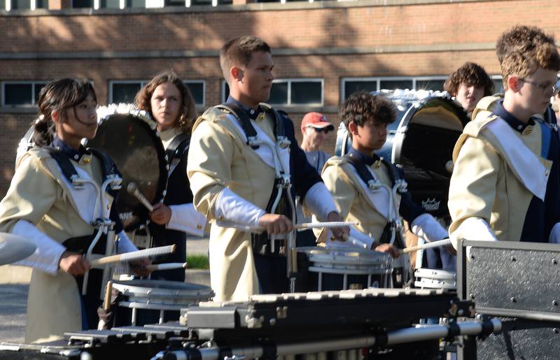 Lemont High School Marching Band members practice prior to participating in the annual Music Bowl Competition held at Downers Grove South Saturday, Oct. 7, 2023.