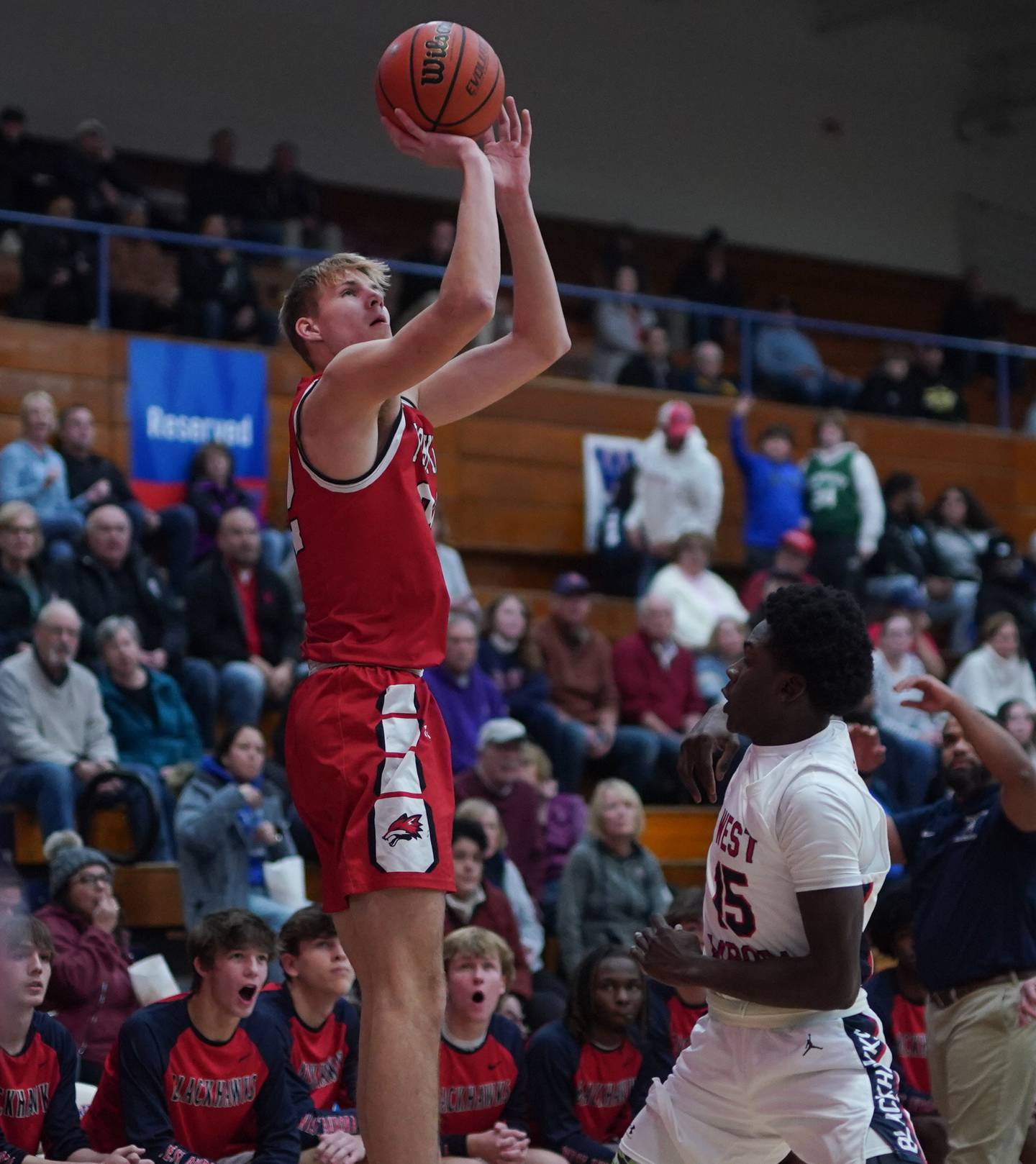 Yorkville's Jason Jakstys (32) shoots a three pointer against West Aurora's Kewon Marshall (15) during a basketball game at West Aurora High School on Tuesday, Nov 28, 2023.