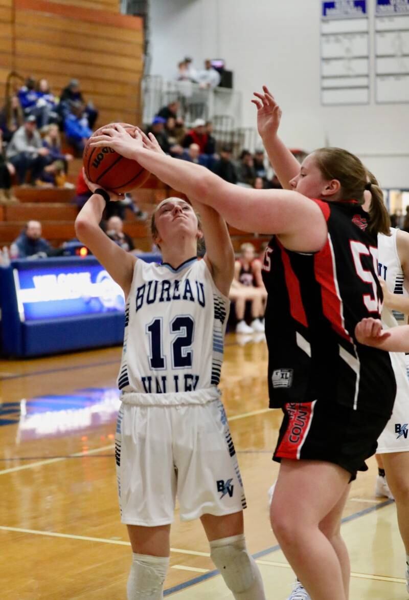 Bureau Valley's Kate Stoller shoots against Stark County's Kylee Frisby at Princeton Monday. The Storm won 41-31.