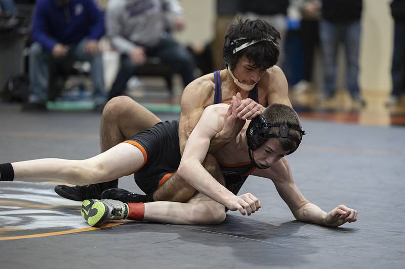 Dixon’s Riley Paredes works on Winnebago’s Cam Whitehead in the 106 pound first place match Saturday, Feb. 14, 2026, during the Class 1A wrestling sectionals in Byron.