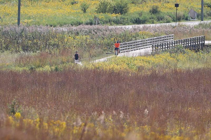People enjoy the path at Hadley Valley Preserve on Thursday, Sept. 12, 2024 in Joliet.