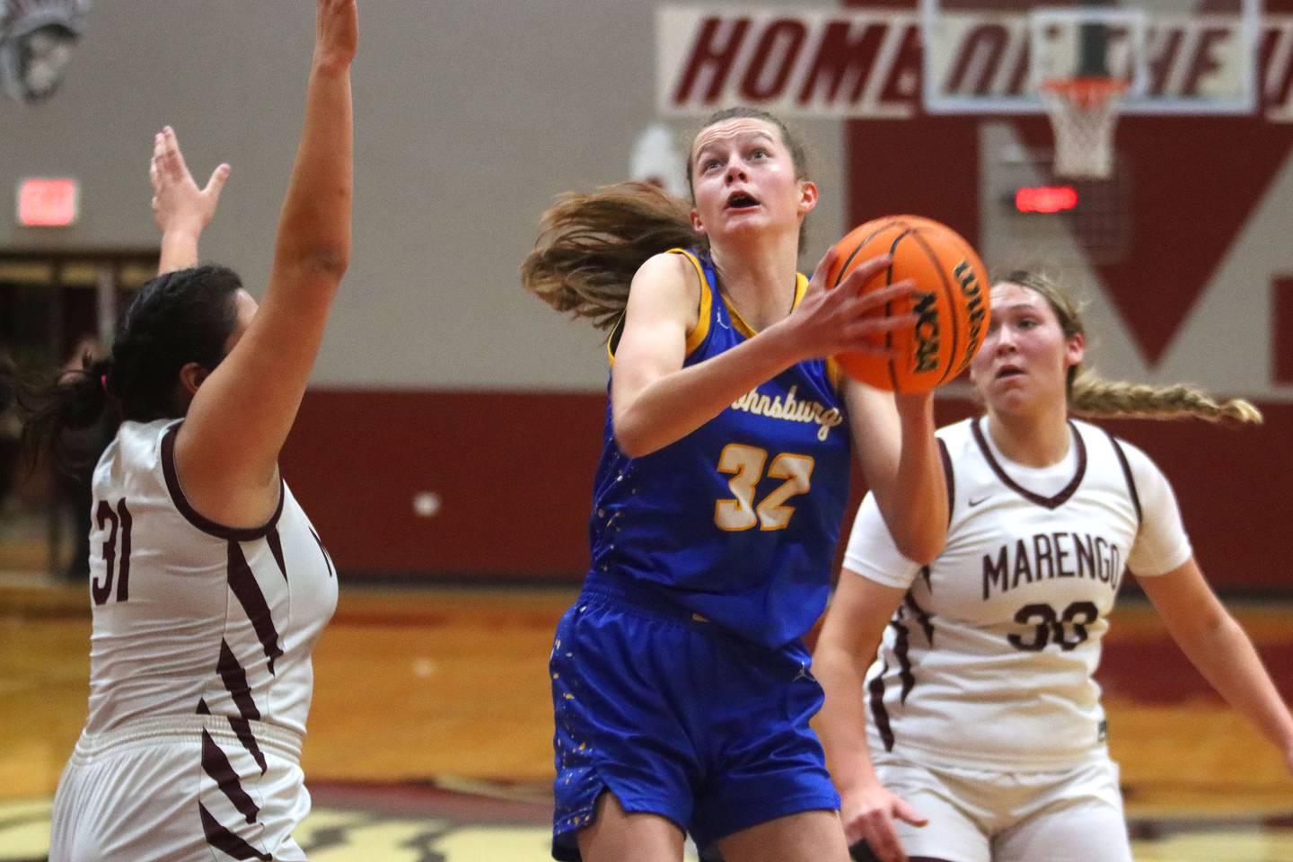 Johnsburg’s Skye Toussaint works under the hoop in varsity girls basketball on Tuesday, Jan. 6, 2026 at Homer “Bill” Barry Gymnasium on the campus of Marengo High School in Marengo.