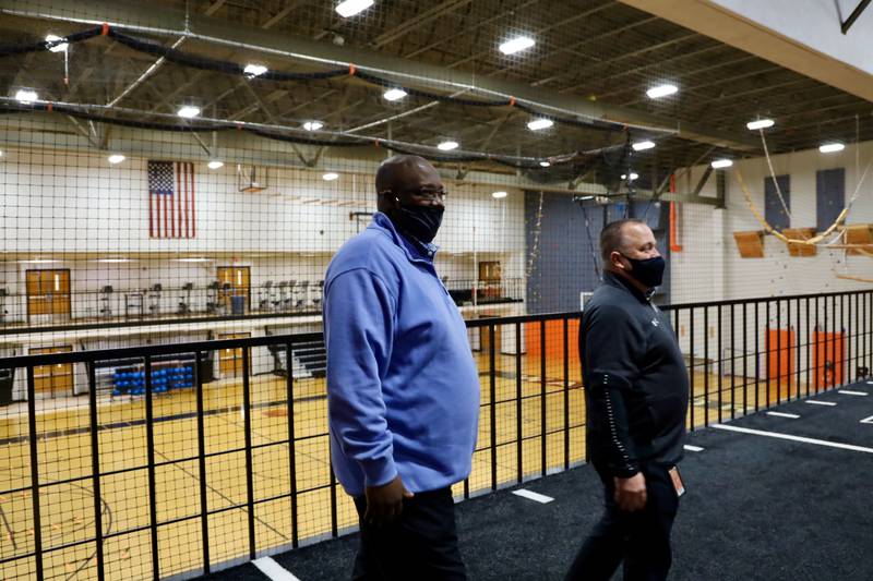 New McHenry athletic director Joel Beard (left) will take over for retiring AD Barry Burmeister this summer. Beard was hired by the District 156 school board Monday night.