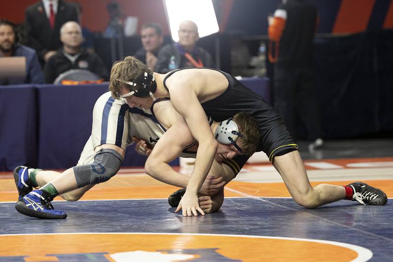Richmond-Burton’s Blake Livdahl (right) and Lena-Winslow’s Eli Larson compete in the 175 pound weight class of the 1A state individual wrestling finals Saturday, Feb. 22, 2025, at State Farm Center in Champaign.