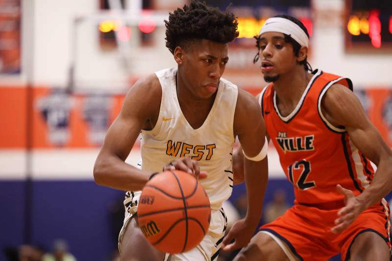 Joliet West’s Jeremy Fears drives to the basket against Romeoville’s Troy Cicero Jr. on Tuesday January 31st, 2023.