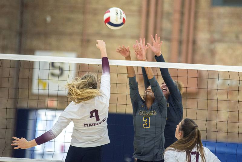 Sterling’s Delali Amankwa and Sterling’s Kirra Gibson work to block a shot by Moline’s Lucy Irvine Thursday, Sept. 1, 2022.