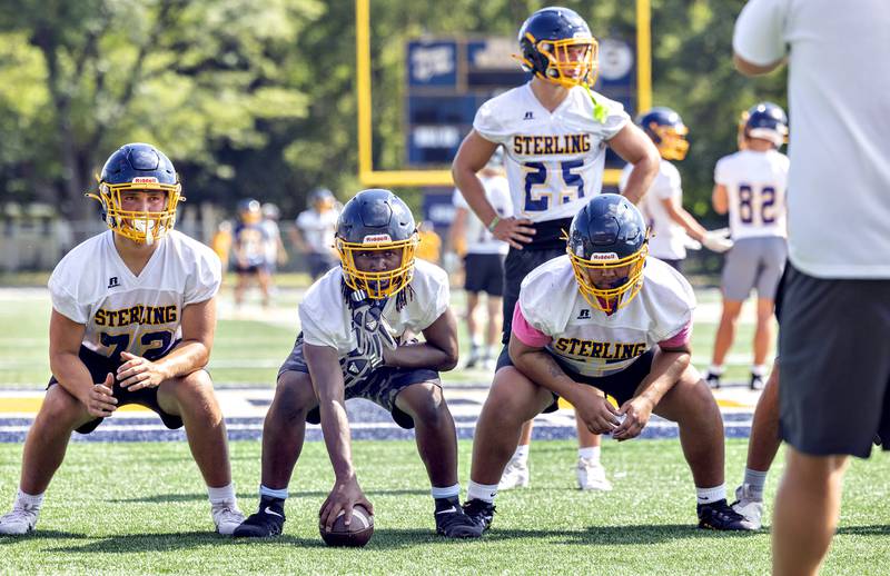 Sterling’s offensive line run through goal line drills Monday, August 11, 2025, for the first day of football practice.