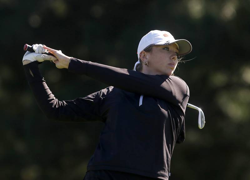 Crystal Lake Co-op’s Delaney Medlyn watches her tee shot the eight hole during the IHSA Class 2A Huntley Girls Golf Regional on Tuesday, Oct. 1, 2024, at Pinecrest Golf Club in Huntley.