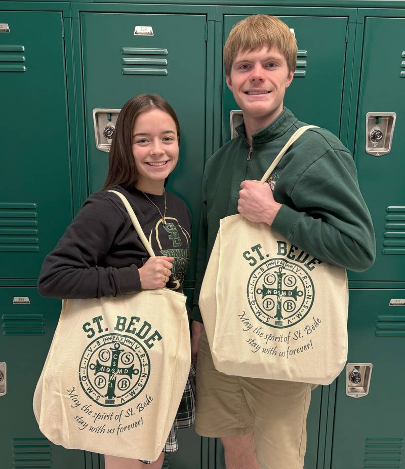 St. Bede Academy seniors Bailey Engels and Greyson Marincic show the St. Bede totes that will be given to anyone who donates $50 or more on March 21, 2025, which is St. Benedict’s Annual Day of Giving.