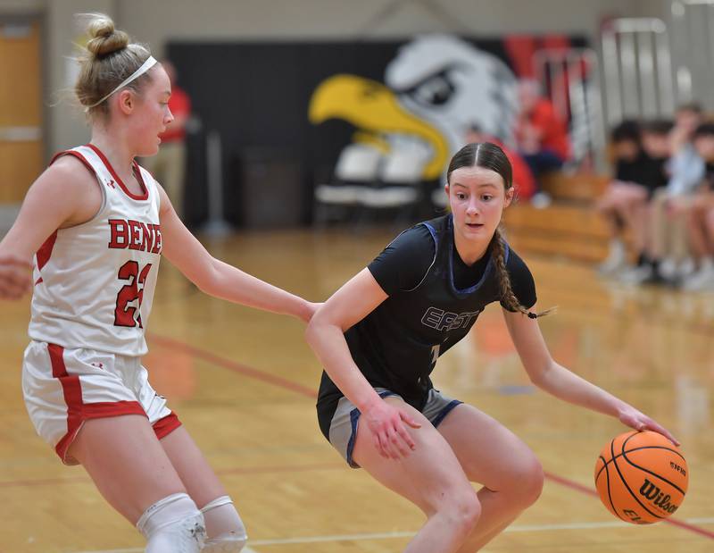 Oswego East’s Aubrey Lamberti looks to drive past Benet’s Bridget Rifenburg (left) during the Class 4A Benet Regional final on February 19, 2026 at Benet Academy in Lisle.