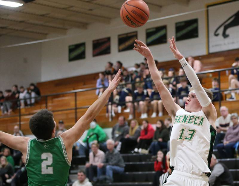 Seneca's Paxton Giertz shoots a fade-away jump shot over Dwight's Dawson Carr during the Tri-County Conference Tournament on Wednesday, Jan. 25, 2023 at Putnam County High School.