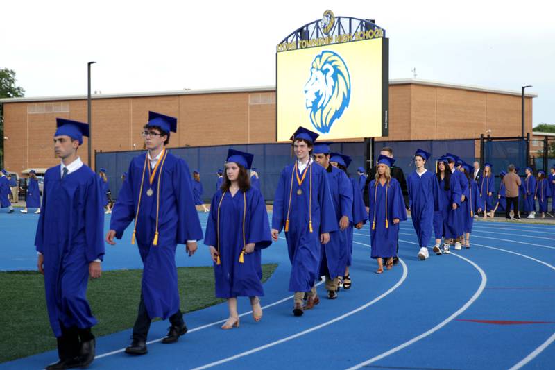 Lyons Township High School graduates process onto Bennett Field for the school’s 2023 commencement ceremony in Western Springs on Wednesday, May 31, 2023.