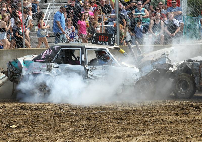 Big Joe Vash's car starts smoking as he competes in the Demolition Derby during the Lake County Fair at the Lake County Fairgrounds on Sunday, July 30th in Grayslake.  
Photo by Candace H. Johnson for Shaw Local News Network