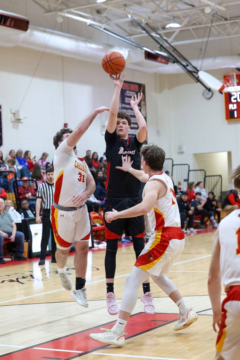 Momence's Tommy Rounds shoots under pressure from St. Anne's Brandon Schoth, left, and Jackson Hawkins during St. Anne's 64-43 victory in the River Valley Conference semifinals on Tuesday, Feb. 10, 2026.