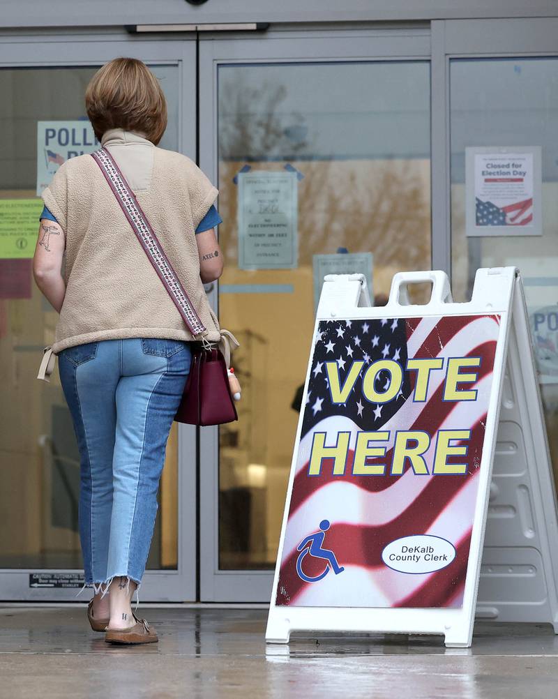 A voter walks into the DeKalb Public Library Tuesday, Nov. 5, 2024, Election Day, to cast their ballot.