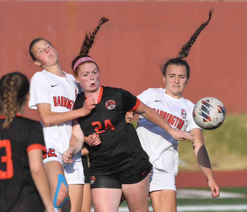 Libertyville’s Ellia Rebman controls a throw-in against Barrington’s Roos Van Roekel, left, and Maddy Ziebarth in the IHSA girls state soccer semifinal game at North Central College in Naperville on Friday, June 2, 2023.