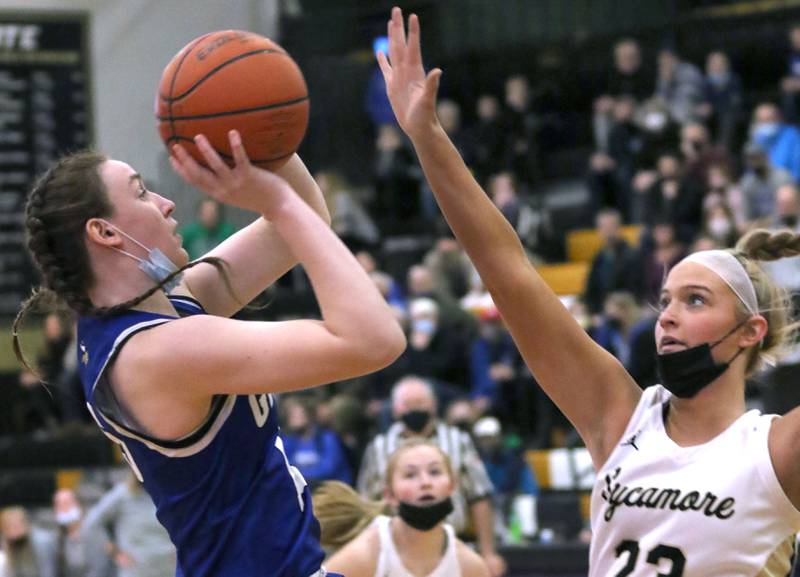 Geneva's Cassidy Arni shoots over Sycamore's Evyn Carrier during their game Thursday, Feb. 10, 2022, at Sycamore High School.