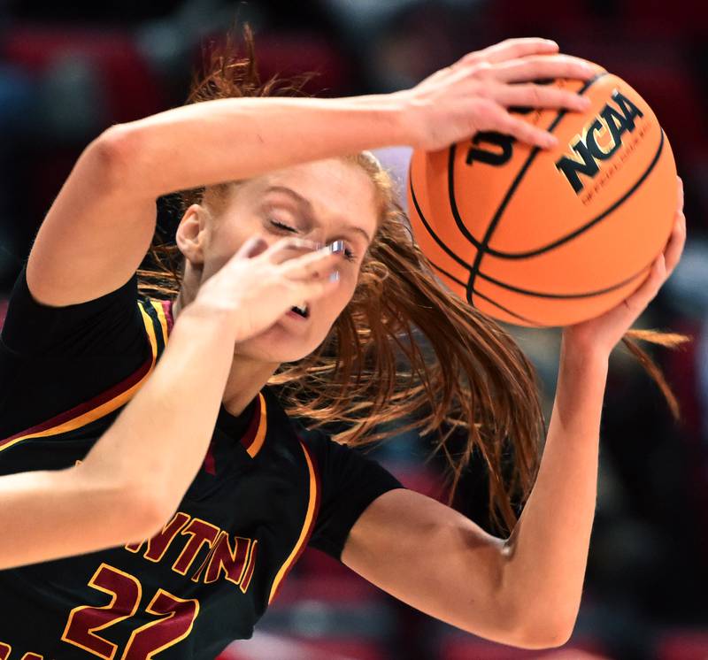 Montini's Audrey Kinney, right, draws contact to the face from St. Ignatius' Maliyah Miller during the IHSA Class 3A girls state basketball championship game at CEFCU Arena on Saturday, March 8, 2025 in Normal.
