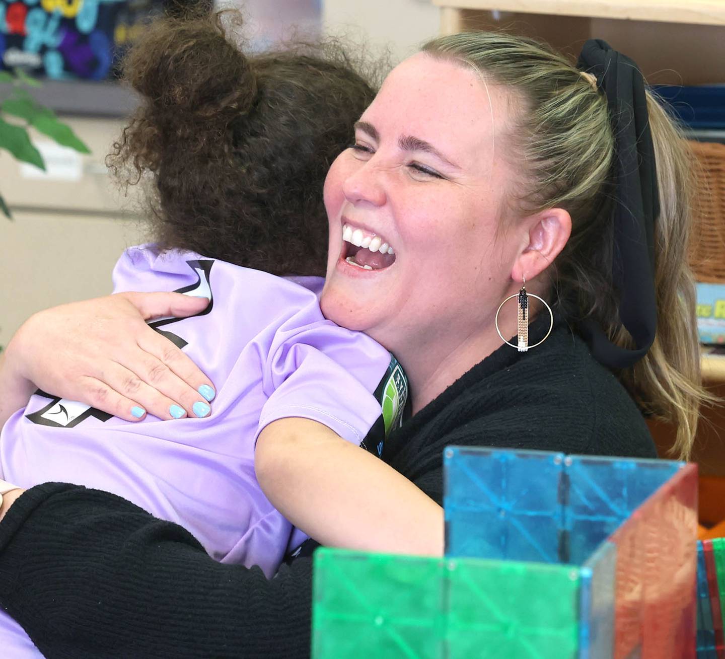 Laurel Copeland, Little Spartans Early Learning Program teacher at South Prairie Elementary School, gets a hug from Avery Anderson during class Wednesday, April 6, 2023, at the school in Sycamore.