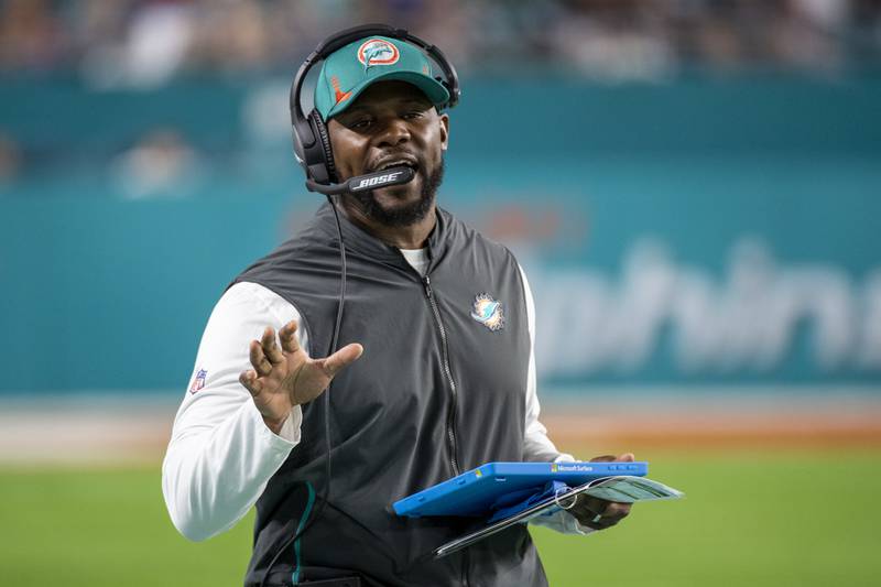 Former Miami Dolphins head coach Brian Flores gestures on the sidelines during a game against the New England Patriots, Sunday, Jan. 9, 2022, in Miami Gardens, Fla.