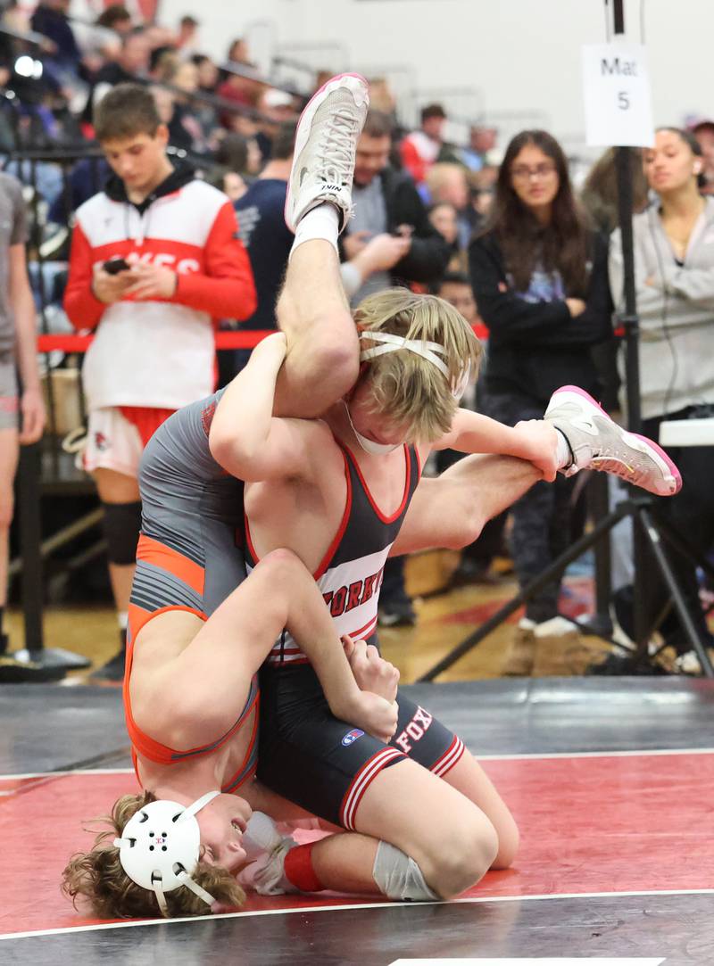 Yorkville's Jack Ferguson goes up against against Minooka's Cale Stonitsch during the Southwest Prairie Conference wrestling meet at Yorkville High School on Saturday, Jan. 21, 2023.