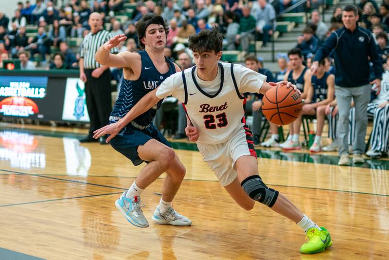 Benet’s Nikola Abusara (23) drives to the basket against Lake Park's Adrian Notardonato (3) during a Bartlett 4A Sectional semifinal boys basketball game at Bartlett High School on Tuesday, Feb 28, 2023.