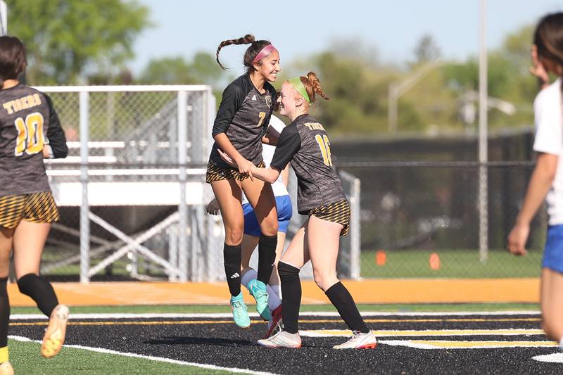 Joliet West’s Abigail Vugteveen, 16, celebrates with Alicia Casillas after her goal against Joliet Central on Tuesday, April 30, 2024.