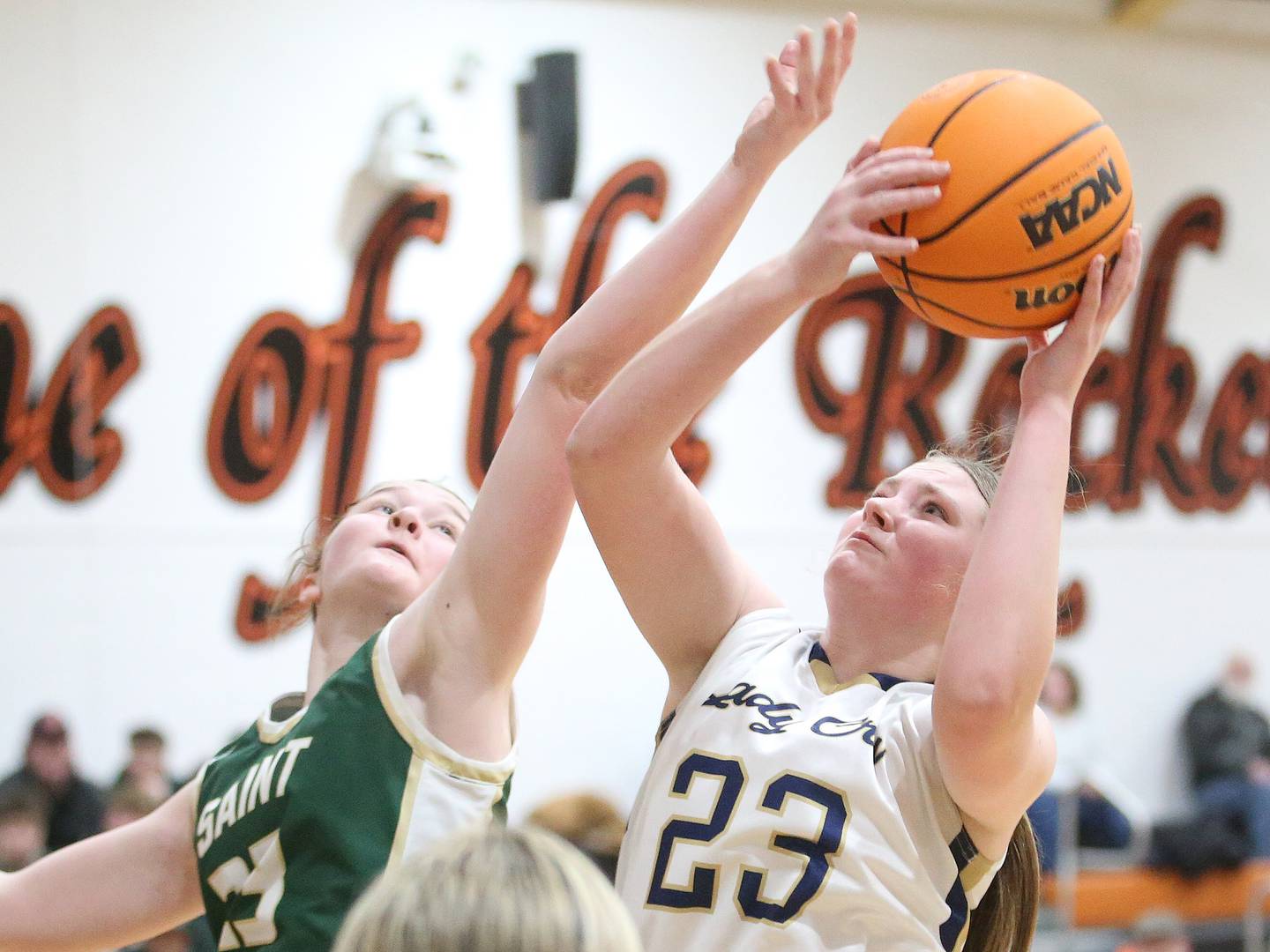 Marquette's Kelsey Cuchra ehes the hoop as St. Bede's Lili McClain defends during the Tri-County Conference championship game on Thursday, Jan. 23, 2025 at Roanoke-Benson High School.