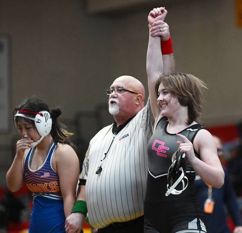 Oswego East’s Quinn Janssens won the 140-pound final against Hoffman Estates’ Abigail Ji during the Schaumburg girls wrestling sectional Saturday.