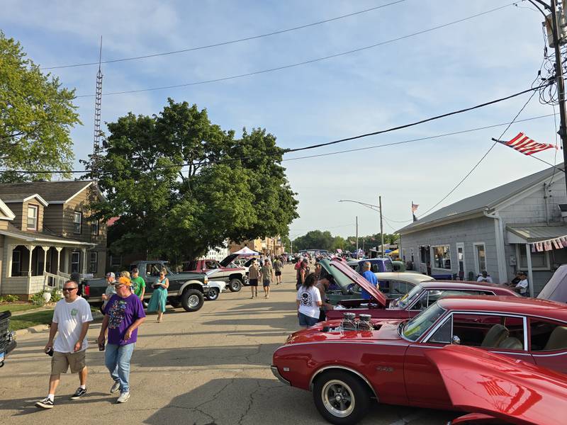 A crowd walks down La Salle Street on Saturday, Aug. 24, 2024, during the Tonica Fest car show.