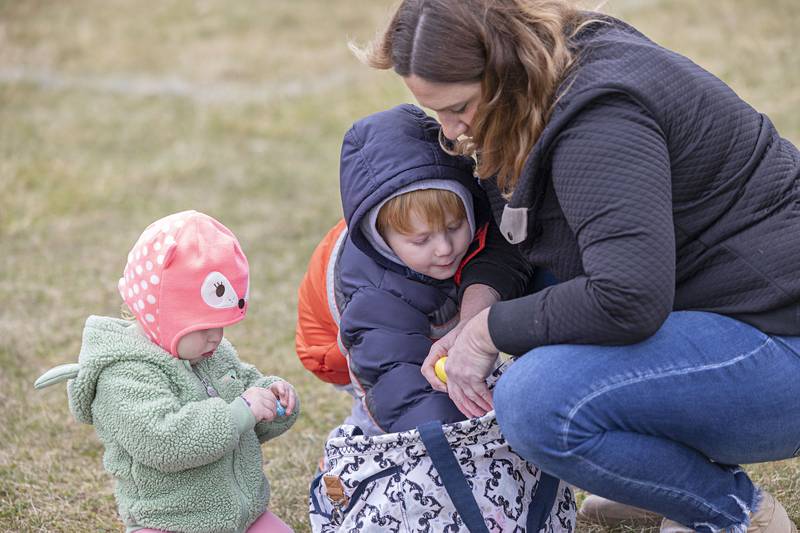 Theory (left), 2, and Fynn, 3, in the care of Melissa Ryan count up their eggs Saturday, March 30, 2024 at the community egg hunt in Polo.