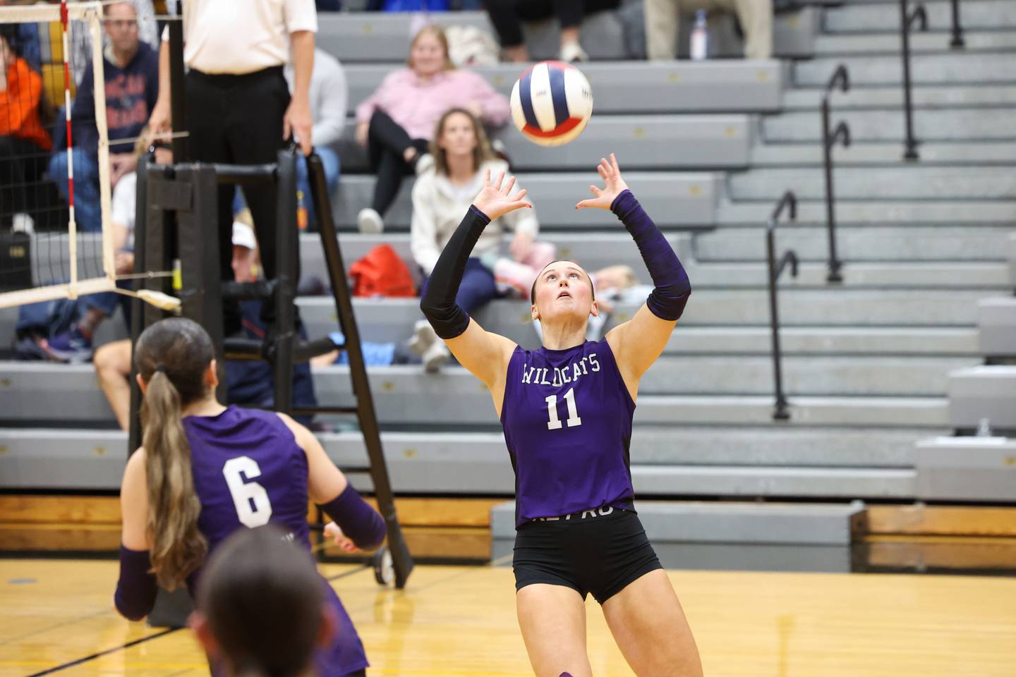 Wilmington's Molly Southall sets the ball during the Wildcats' loss in three sets, 25-16, 22-25, 17-25, to Pontiac in the IHSA Class 2A Herscher Regional championship on Thursday, Oct. 30, 2025.