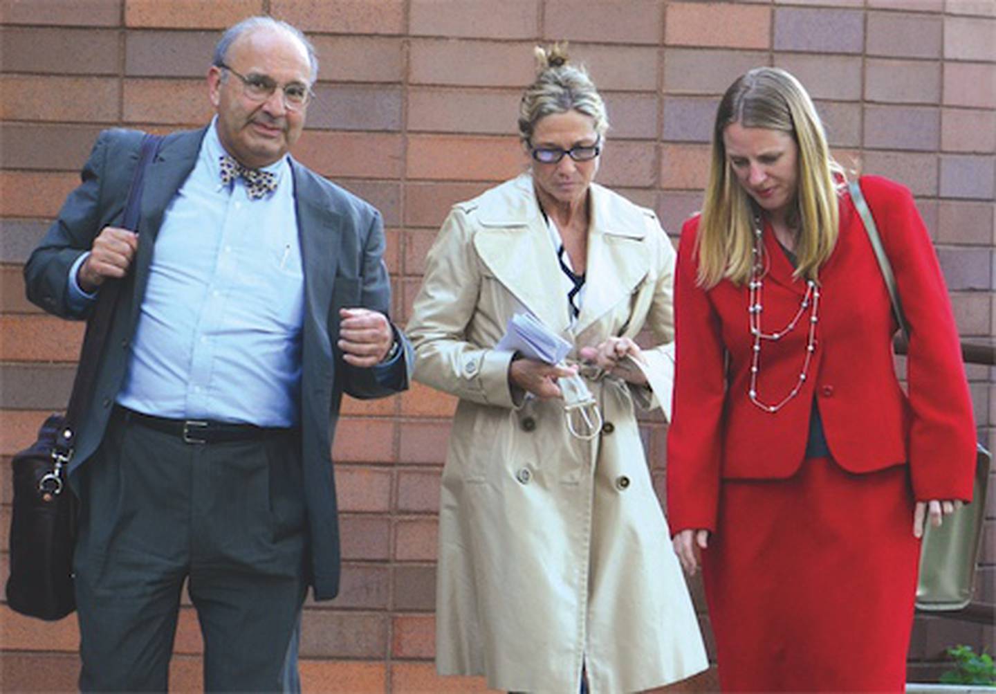 Dixon Comptroller Rita Crundwell (center) leaves the federal courthouse in Rockford on Wednesday afternoon after U.S. District Court Judge Michael Mahoney released her on a $4,500 recognizance bond. Crundwell, charged with wire fraud, had been jailed in Ogle County since her arrest Tuesday morning at Dixon City Hall. Walking with Crundwell are her attorneys, Paul Gaziano (left) and Kristin Carpenter.