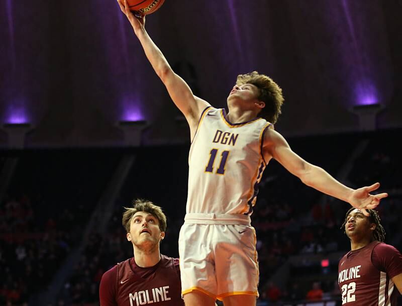 Downers Grove North's Owen Thulin runs in the lane to score over Moline's Owen Freeman and Treyvon Taylor during the Class 4A state semifinal game on Friday, March 10, 2023 in Champaign.